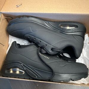 New in box. Skechers stand in air in black size 8